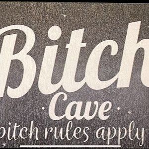 "The Bitch Cave" sign